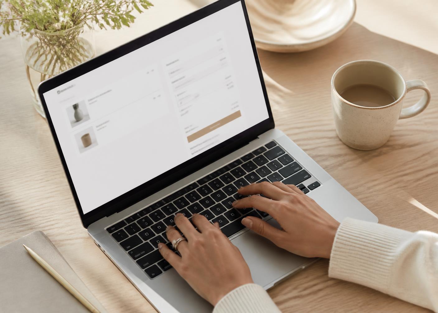 A shopper completing the checkout on a laptop